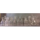 A COLLECTION OF TWENTY 19TH CENTURY AND LATER CUT LEAD CRYSTAL DECANTER BOTTLES Including a pair