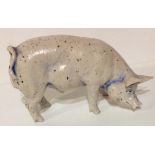 A 19TH CENTURY CONTINENTAL PORCELAIN MODEL OF A PIG Standing pose with indigo blue ink pooling to