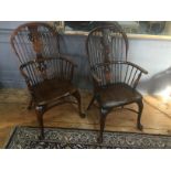 A MATCHED PAIR 19TH CENTURY WINDSOR CHAIRS One yew and elm, hoop back design with pierced splat over