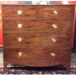 A GEORGIAN MAHOGANY CHEST OF DRAWERS Having an arrangement of two short above three long drawers,