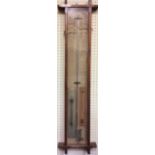 A VICTORIAN OAK ADMIRAL FITZROY BAROMETER Central mercurial glass tube, thermometer and atmosphere
