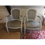 A PAIR OF LATE 19TH CENTURY FRENCH OPEN ARMCHAIRS With cream finished frames, upholstered seats