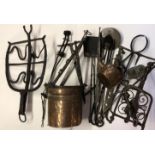 A MIXED LOT OF 18TH CENTURY AND LATER METAL WARES To include spit hooks, trivets, fire irons etc.