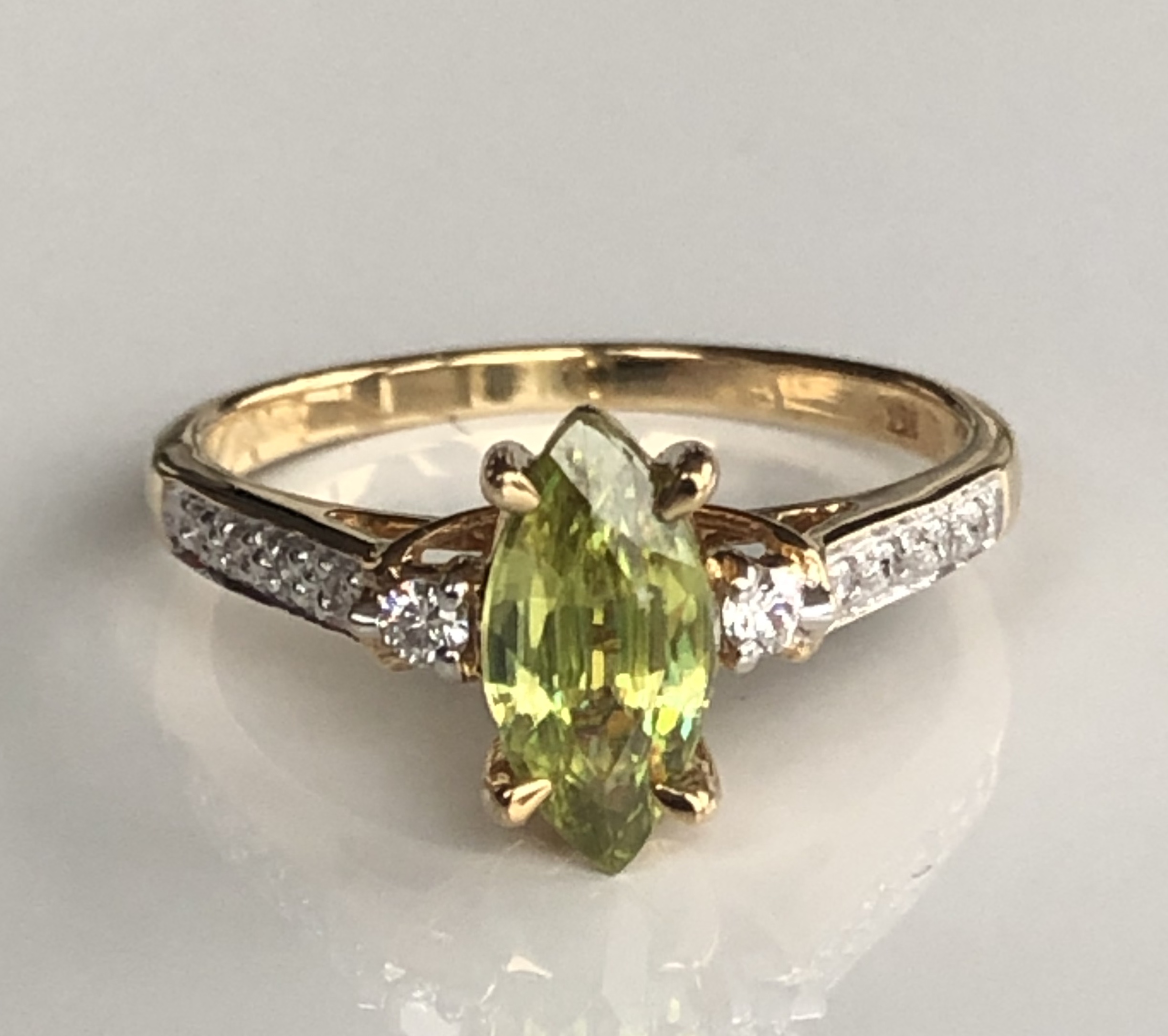 AN 18CT GOLD, CAPELINHA SPHENE AND DIAMOND RING The marquise cut Capelinha Sphene on diamond