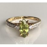 AN 18CT GOLD, CAPELINHA SPHENE AND DIAMOND RING The marquise cut Capelinha Sphene on diamond