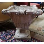 AN EARLY 20TH CENTURY LIMED WOOD PLANTER Carved with foliage, raised on a socle with platform