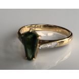 AN 18CT WHITE GOLD, SANTA ROSA TOURMALINE AND DIAMOND RING The tapered baguette cut tourmaline