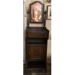 AN EDWARDIAN MAHOGANY AND SATIN WOOD BANDED GENTLEMAN'S DRESSER With central mirror above a single