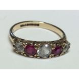A VINTAGE 9CT GOLD, RUBY AND QUARTZ FIVE STONE RING The graduating white stones interspersed with