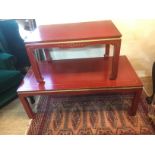 TWO 20TH CENTURY RED LACQUERED TABLES Both with gilt floral decoration. (largest w 122cm x h 46cm