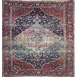 A MIDDLE EASTERN RUG Having a pendant medallion amongst floral motifs, contained within frieze and