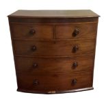 A VICTORIAN MAHOGANY BOW FRONTED CHEST OF DRAWERS Having an arrangement of two short over three long