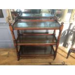 A 19TH CENTURY MAHOGANY THREE TIER BUFFET With gallery back and two drawers, raised on castors. (h