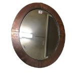 ARTS & CRAFTS, A COPPER MIRROR With bevelled edge plate and stamped motif to frame. (h 56cm x w