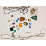 A COLLECTION OF LOOSE GEMSTONES Including amethyst, citrine, malachite, aquamarine and opal.