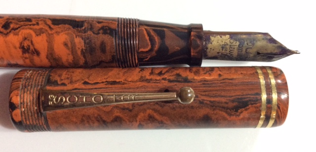 A VINTAGE CONWAY STEWART DURO FOUNTAIN PEN Having a mottled orange marble case and a 14ct gold - Image 2 of 2