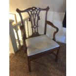 A GEORGE III MAHOGANY CHIPPENDALE DESIGN OPEN ARMCHAIR With pierced back and drop in seat, raised on