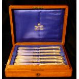 MAPPIN & WEBB, A SET OF SIX WHITE METAL FISH SERVERS With scroll engraved decoration and Mappin &