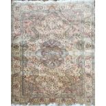 A MIDDLE EASTERN RUG With a central floral medallion and decoration contained within frieze and