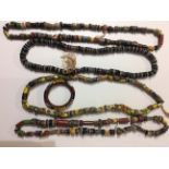 A COLLECTION OF VENETIAN GLASS AFRICAN TRADE BEAD NECKLACES Rope twist bindings set with
