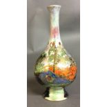 AN EARLY 20TH CENTURY LUSTREWARE POTTERY BALUSTER VASE Hand painted with an exotic garden scene,