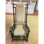 AN EARLY 20TH CENTURY AMERICAN DESIGN ROCKING CHAIR With turned frame and sage upholstery over a