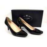 PRADA, A PAIR OF BLACK PATENT LEATHER COURT SHOES Boxed (size 35.5).