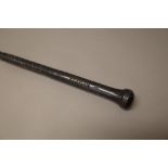 A SOUTHSEA ISLANDS EBONISED LONG STICK With a carved grip and bulbous pommel. (130cm)