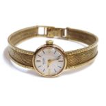 A VINTAGE 9CT GOLD LADIES' WRISTWATCH The circular dial marked 'Record' and retaining original 9ct