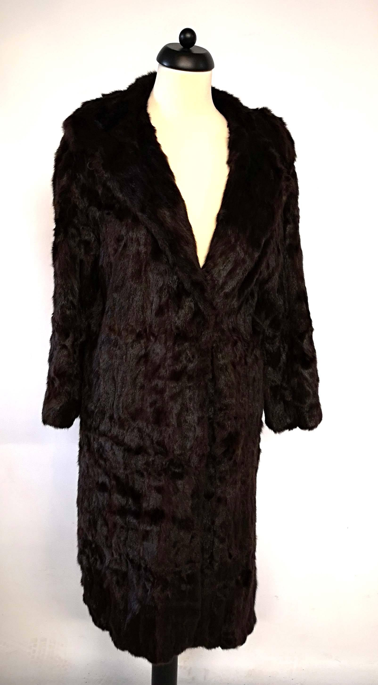 A VINTAGE CHOCOLATE BROWN ¾ LENGTH FUR COAT.