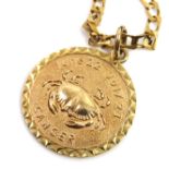 A VINTAGE 9ct GOLD ASTROLOGICAL PENDANT AND NECKLACEthe circular pendant embossed with a crab ~