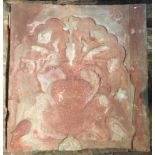 A LARGE INDIAN SANDSTONE WALL TILE Carved in relief with flowers in a vase. W 80cm x H 86cm x D 7cm