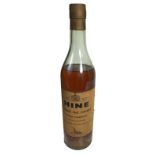 A VINTAGE BOTTLE OF HINE 1960 COGNAC in clear bottle and the label reading ~Grande Champagne