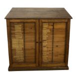 A VICTORIAN OAK AND PINE DOCTORS SPECIMEN CABINETthe two glazed doors enclosing 60 drawers bearing