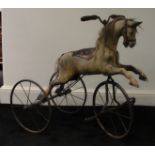 A VICTORIAN CHILD’S HORSE TRICYCLE VELOCIPEDE With twin handles pivoting the front wheel and twin