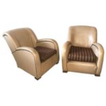 A PAIR OF STYLISH ART DECO PERIOD CLUB ARMCHAIRS upholstered in a later cream faux leather, with