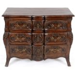 AN 18TH CENTURY AND LATER FRENCH CARVED OAK AND ELM SERPENTINE COMMODE Decorated with flowers and