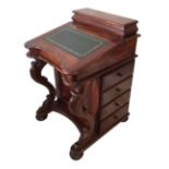 A VICTORIAN DESIGN MAHOGANY DAVENPORT DESK Having a green tooled leather over carved supports with