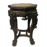 A LATE 19TH CENTURY CHINESE HARDWOOD PLANT STAND With rouge marble inset top above a pierced