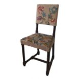 A 19TH CENTURY OAK GOTHIC DESIGN CORRECTIONAL CHILD’S CHAIR With upholstered tapestry back and seat.