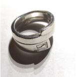 GUCCI, A VINTAGE SILVER SORORAL FORM RING With Gucci monogram (size L).