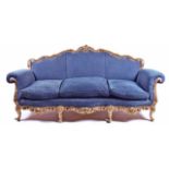 A DECORATIVE FRENCH ROCOCO DESIGN CARVED AND PIERCED GILTWOOD SETTEE The shaped scrolling back