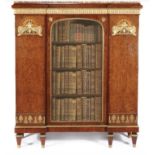 A 19TH CENTURY RUSSIAN AMBOYNA AND INLAID INVERTED BREAKFRONT BOOKCASE Of Neoclassical design,