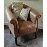 A CONTEMPORARY LEATHER UPHOLSTERED TUB CHAIR Raised on square section legs and with rounded back. (h