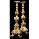 A PAIR OF DECORATIVE 18TH CENTURY ITALIAN CARVED GILTWOOD AND PAINTED PRICKET STANDS. (h 64cm)