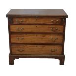 A 19TH CENTURY MAHOGANY BACHELOR’S CHEST The fold over top above four graduating drawers fitted with