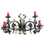 A PAIR OF EARLY 19TH CENTURY GERMAN CAST IRON WALL SCONCES Scrolled arms with portrait horned