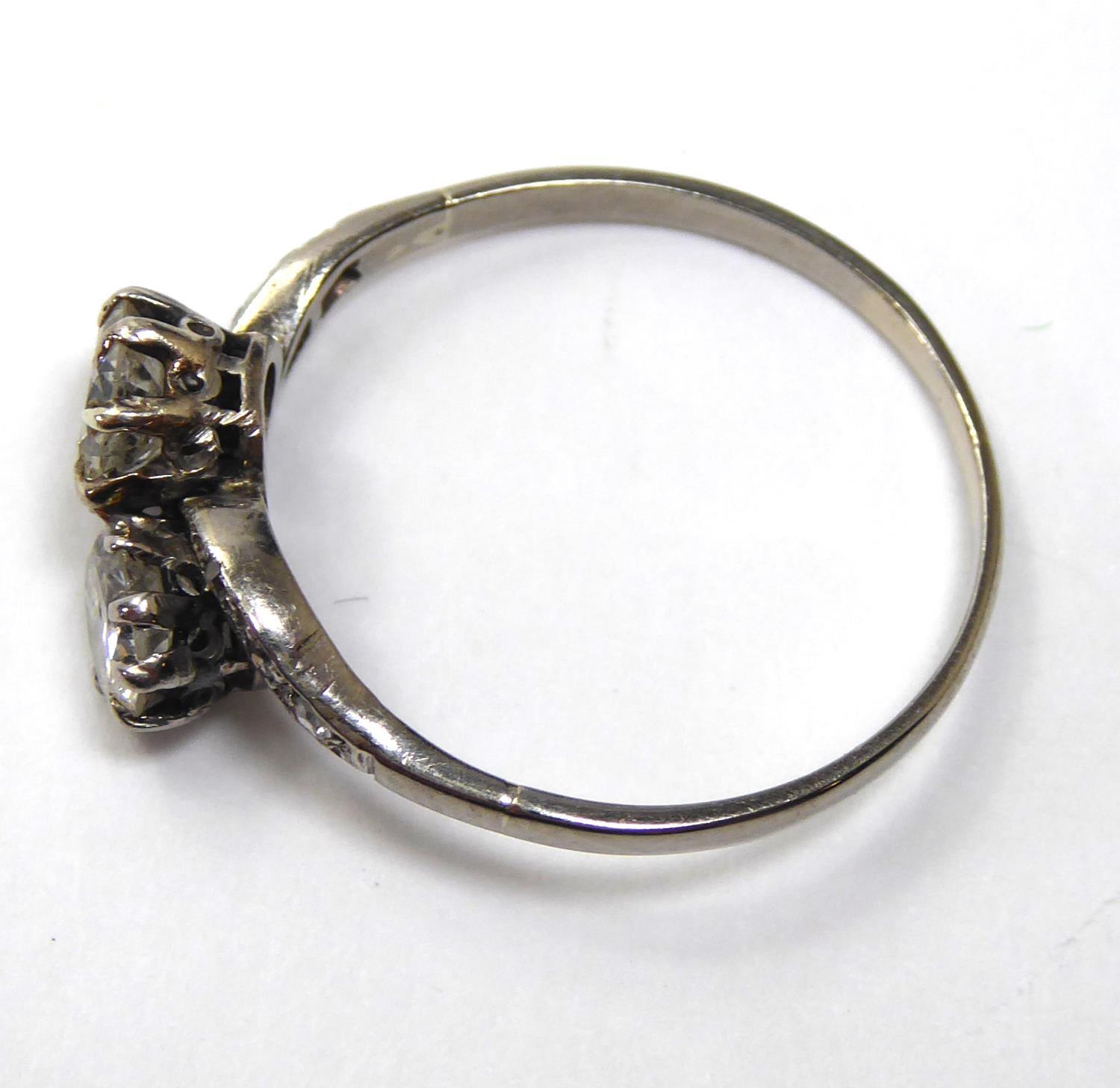 AN EARLY 20TH CENTURY 18CT WHITE GOLD AND DIAMOND TWIST RING Two round cut diamonds set in a half - Image 7 of 8