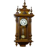 AFTER CHRISTOPHER DRESSER, A 20TH CENTURY MAHOGANY CASED VIENNA REGULATOR CLOCKWith shaped