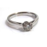 AN 18ct WHITE GOLD AND DIAMOND SOLITAIRE RINGa single round cut stone in a plain mount.Approx 0.33ct